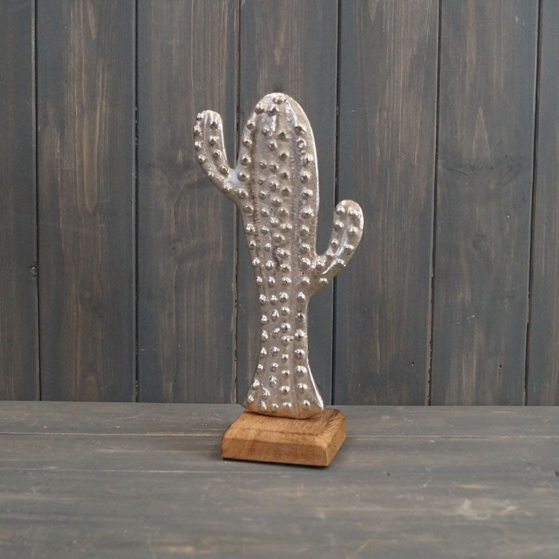 A delightful hand finished cactus ornament made from Aluminium and displayed on a wooden plinth. detail page